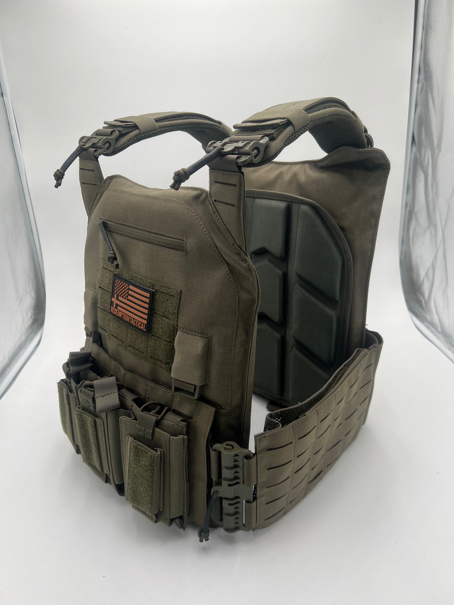 Complete Crusader 2.0 XL Armor Kit laid out with tactical carrier, Level IV plates, medic pouch, and padded laptop bag from Green Tip Surplus.