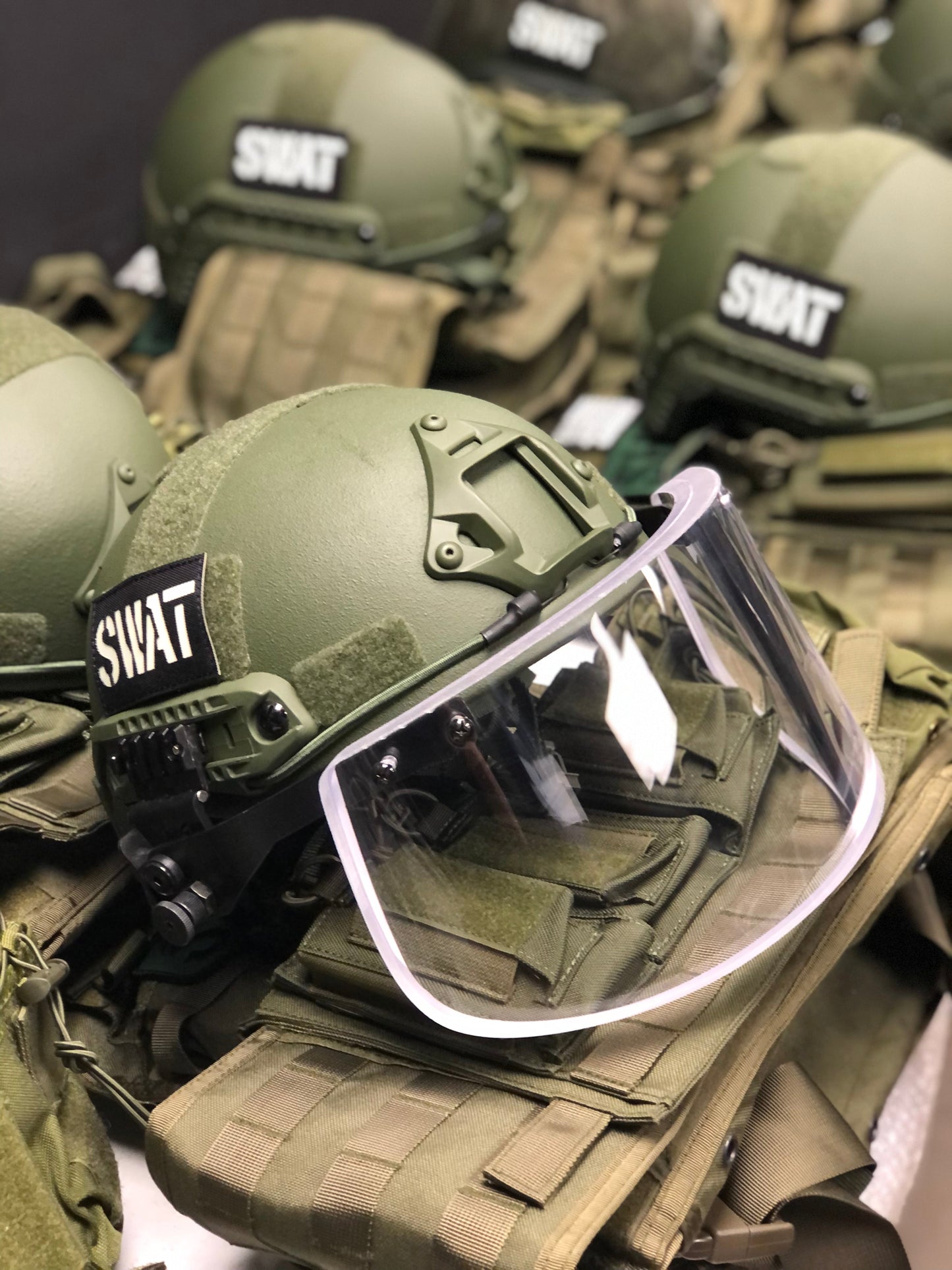 Face shield with helmet ARC rail mount, ballistic glass protection tested to NIJ Level IIIA standards, includes protective cover for safe storage