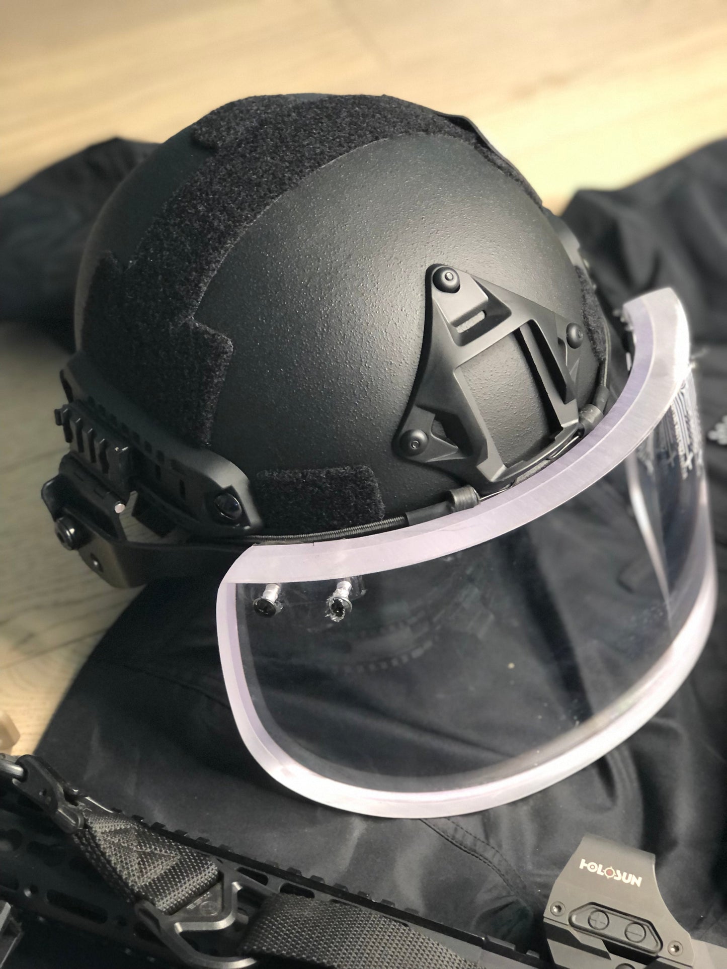 Level IIIA Ballistic Glass Face Shield, attaches securely to helmets using ARC rail mounts, offering face protection without compromising visibility