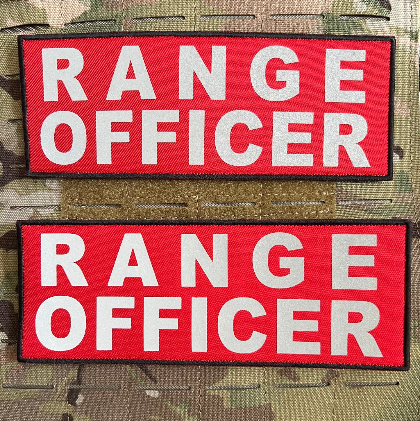 Pair of RANGE OFFICER reflective patches (3” x 8”) with hook and loop backing for easy attachment to tactical vests or gear, designed for night-time visibility