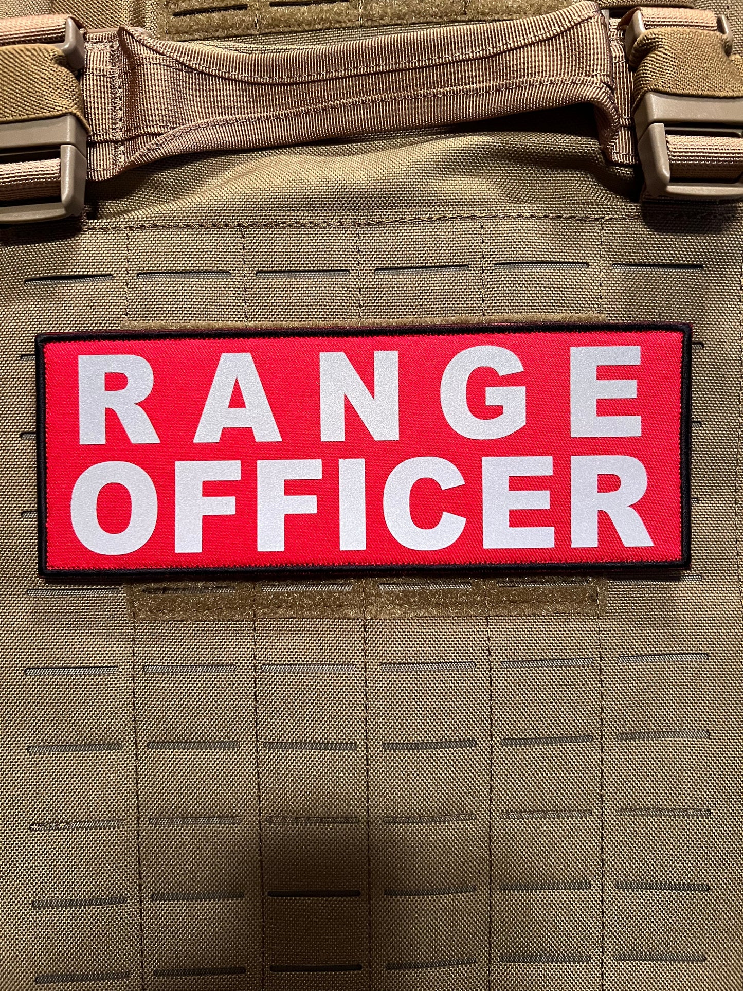 Pair of 3” x 8” RANGE OFFICER reflective patches with hook and loop, ideal for attaching to tactical gear or plate carriers for high-visibility identification