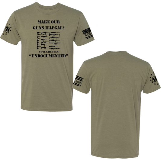 Bold political statement t-shirt reading 'Take away our guns, we'll call them undocumented' in clean, high-contrast typography