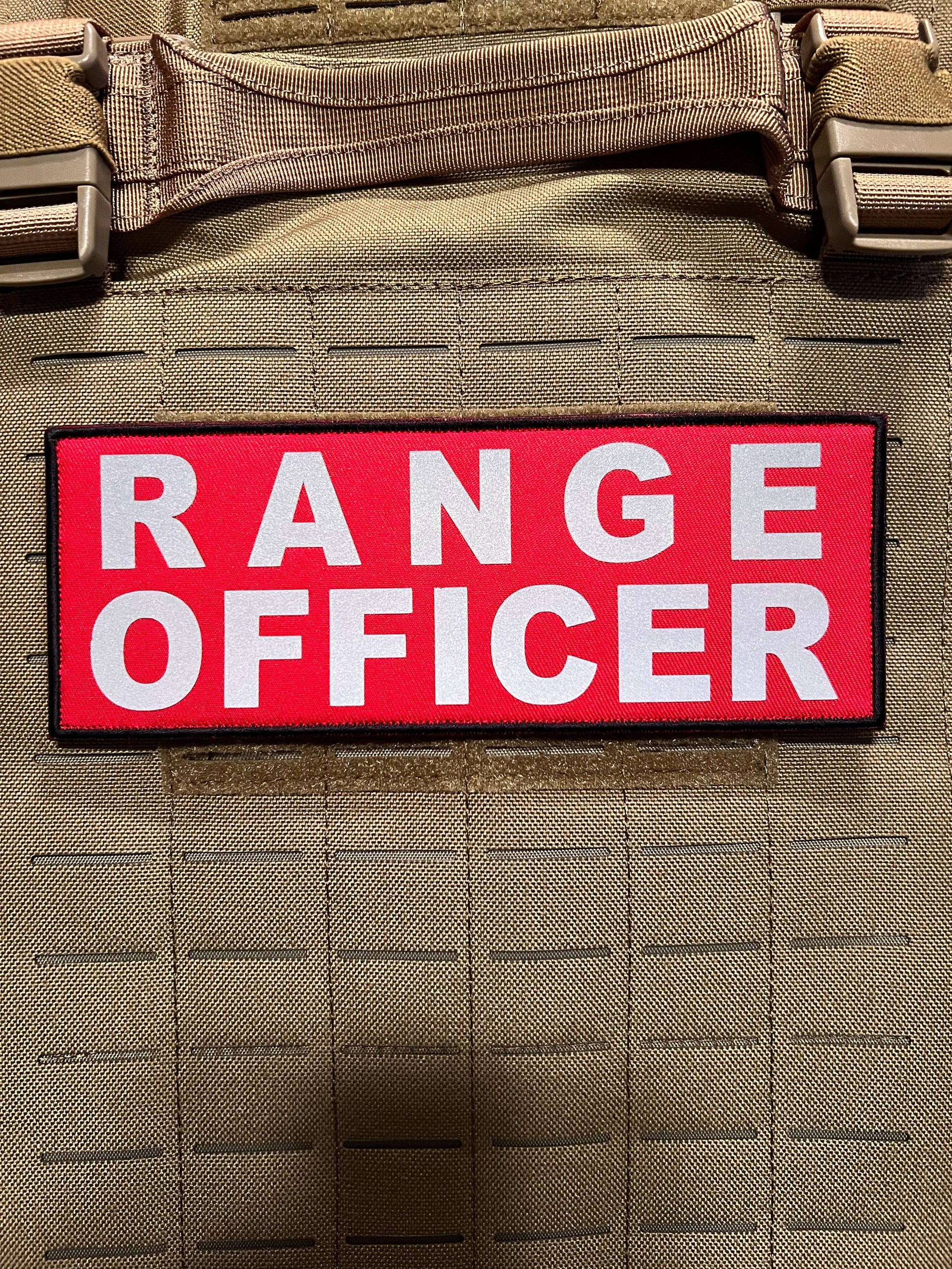 Pair of 3” x 8” RANGE OFFICER reflective patches with hook and loop, ideal for attaching to tactical gear or plate carriers for high-visibility identification